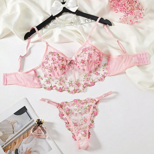 Conjunto Mirella NuAuge rosa. Sutiã alongado com aro, malha fina transparente e delicado bordado floral. Calcinha fio dental combinando.